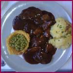 Lomo de ciervo con setas al vino tinto Comiendo en El Llantar de la Sierra (Guadalix de la Sierra, Madrid)