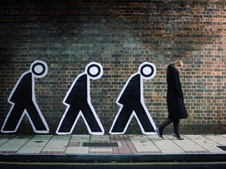 Businesswoman and Human Figures Walking