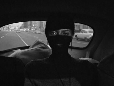 Woman in Car Obscured by Shadows