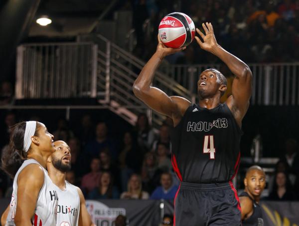 Bolt shoots during the NBA All-Star celebrity basketball game in Houston