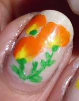 Manicura naranja y amarillo, borde negro. Manicura naranja y amarillo, borde negro.