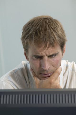 Businessman Concentrating on Computer
