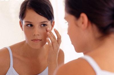 Teenage Girl Looking in Mirror