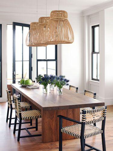 For beachy boldness, designer Sally Markham lit the dining table with rattan Orbita pendant lamps by Tomoko Mizu.