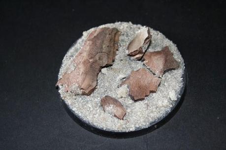 Pegado de la arena en la peana Pegado de la arena en la peana