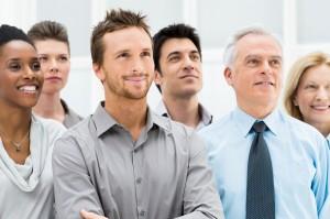 7 características de las personas con carisma Successful Business People Standing Together and Looking at Thei