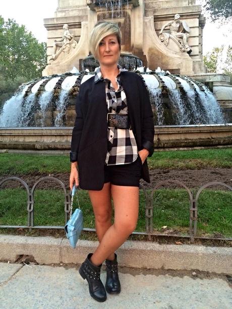 Checked shirt and black shorts. Checked shirt and black shorts.