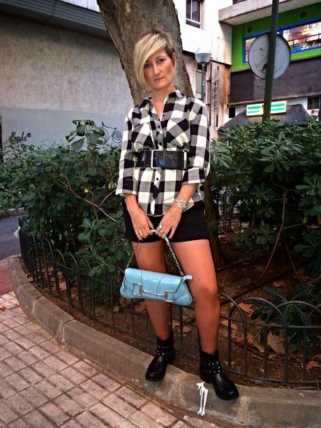 Checked shirt and black shorts. Checked shirt and black shorts.