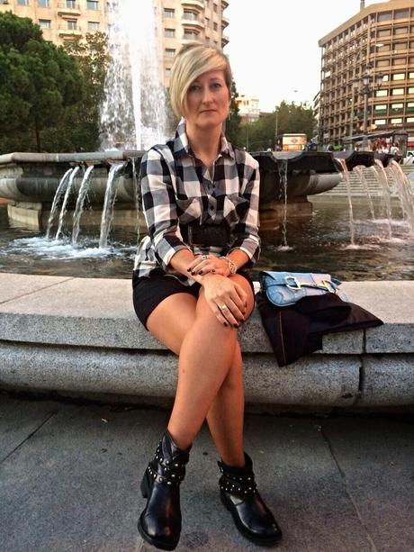 Checked shirt and black shorts. Checked shirt and black shorts.