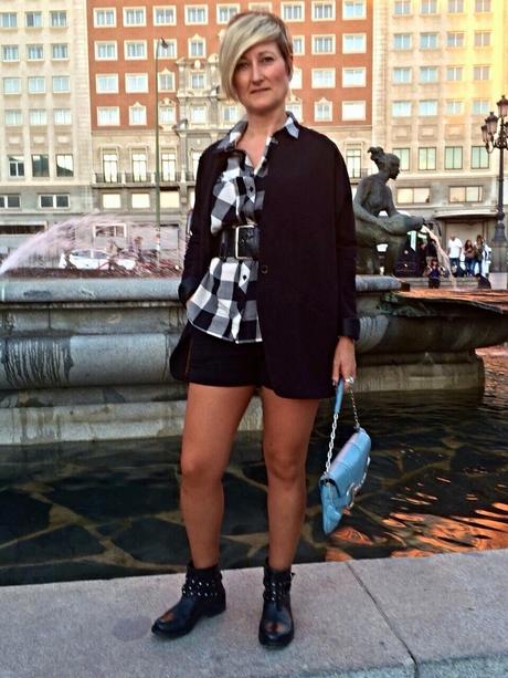 Checked shirt and black shorts. Checked shirt and black shorts.