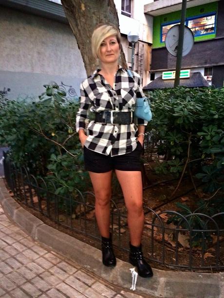 Checked shirt and black shorts. Checked shirt and black shorts.