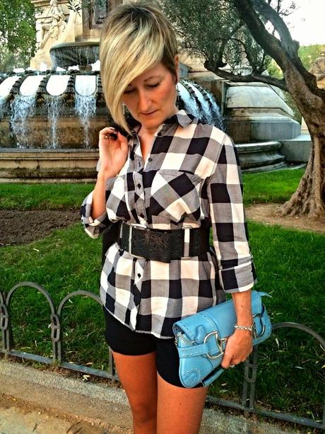 Checked shirt and black shorts. Checked shirt and black shorts.