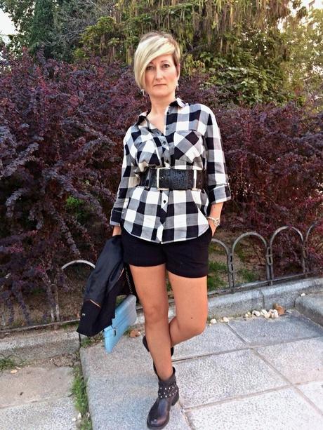 Checked shirt and black shorts. Checked shirt and black shorts.