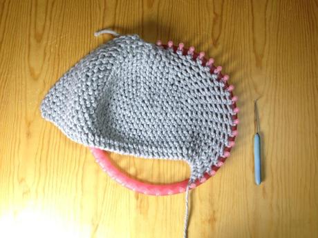 Loom knitted cloche hat before closing up