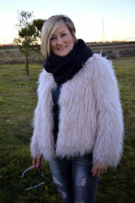 Fur coat and ripped jeans. A special shooting. Fur coat and ripped jeans. A special shooting.