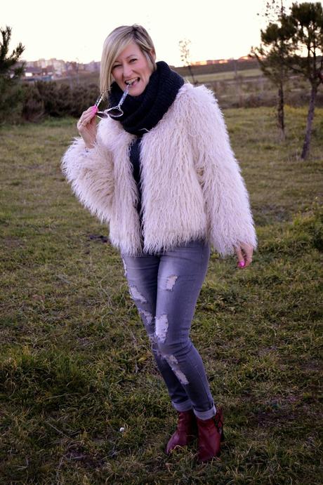 Fur coat and ripped jeans. A special shooting. Fur coat and ripped jeans. A special shooting.