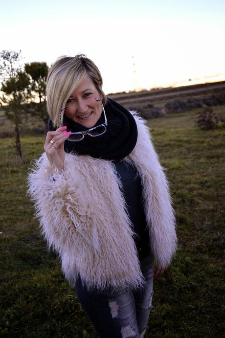 Fur coat and ripped jeans. A special shooting. Fur coat and ripped jeans. A special shooting.