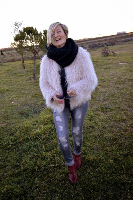 Fur coat and ripped jeans. A special shooting. Fur coat and ripped jeans. A special shooting.