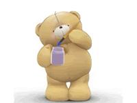 Un osito Teddy con babero tejido a crochet de bebé. (A crocheted bid for a babyTeddy Bear) Un osito Teddy con babero tejido a crochet de bebé. (A crocheted bid for a babyTeddy Bear)