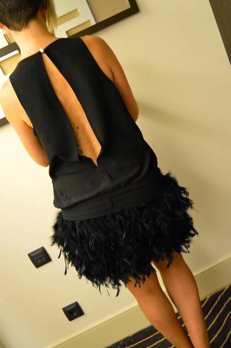 Feathers dress, biker and pumps stilettos. Party look.