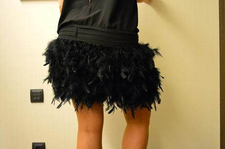 Feathers dress, biker and pumps stilettos. Party look.