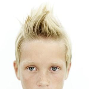 Young Boy (8-10) with His Hair Sticking Up