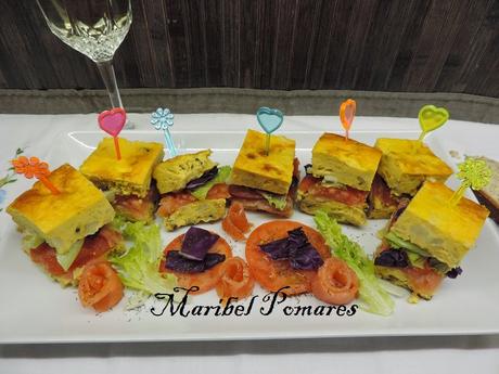 Montaditos o pinchos de tortilla de patata, cebolla, calabacin, salmón ahumado, tomate, lechuga y col lombarda. Montaditos o pinchos de tortilla de patata, cebolla, calabacin, salmón ahumado, tomate, lechuga y col lombarda.
