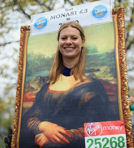 A-runner-poses-for-a-photograph-before-the-Virgin-Money-London-Marathon-2