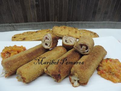 Flamenquines de pan bimbo, jamón york y queso con rebozado de pan rallado con queso, ajo y perejil. Flamenquines de pan bimbo, jamón york y queso con rebozado de pan rallado con queso, ajo y perejil.