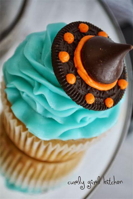 Halloween Cupcakes - make witches' hats from half an Oreo, orange icing, and a Hershey's Kiss!: 