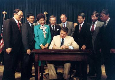 Ronald_Reagan_signing_Japanese_reparations_bill