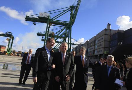 Democratic Governor Terry McAuliffe of Virginia (C) walks near members of his delegation at the Mariel port in Artemisa province, Cuba  January 5, 2015. Virginia's port authority will become the first U.S. port operator to sign a cooperation agreement with its Cuban counterpart, in an effort to increase trade and establish direct service with Cuba, Virginia's governor said on Monday. REUTERS/Enrique de la Osa