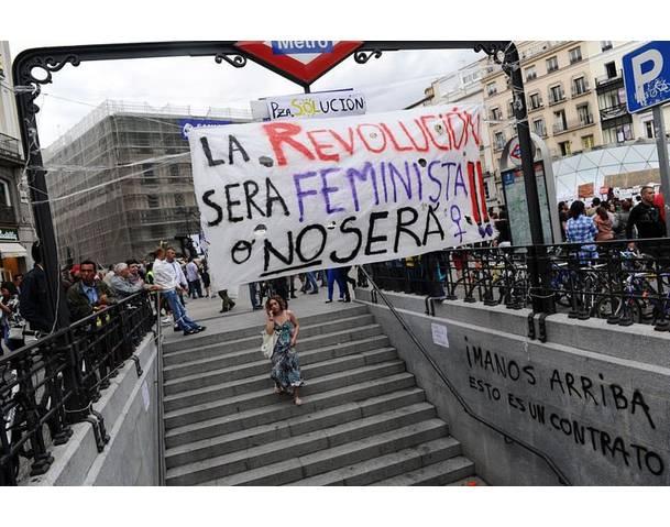 DEMOCRACIA REAL, YA! People enter the subway at the Puerta del Sol square