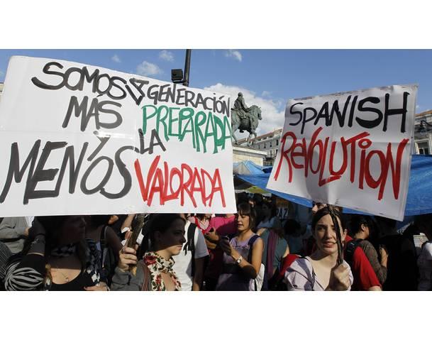 DEMOCRACIA REAL, YA! Demonstrators hold up banners in Madrid's Puerta del Sol