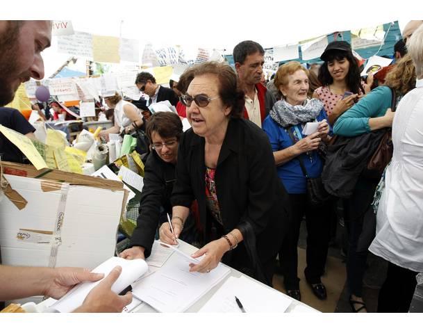 DEMOCRACIA REAL, YA! Women attend a protest at Madrid's famous landmark Puerta del Sol