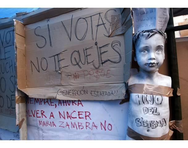 DEMOCRACIA REAL, YA! Graffiti are seen at a demonstrators' camp at Madrid's famous landmark Puerta del Sol