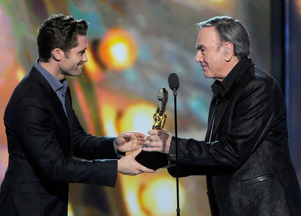 Singer Neil Diamond accepts the Icon Award from actor Matthew Morrison onstage during the 2011 Billboard Music Awards at the MGM Grand Garden Arena May 22, 2011 in Las Vegas, Nevada.