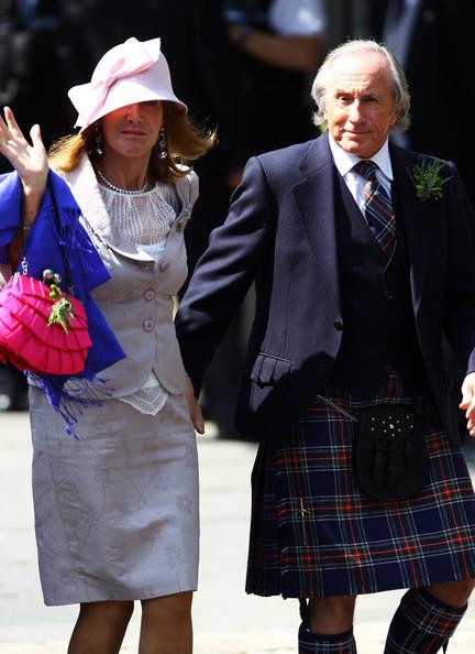 Sir Jackie Stewart and wife Hellen Stewart arrive for the Royal wedding of Zara Phillips and Mike Tindall at Canongate Kirk on July 30, 2011 in Edinburgh, Scotland. The Queen's granddaughter Zara Phillips will marry England rugby player Mike Tindall today at Canongate Kirk. Many royals are expected to attend including the Duke and Duchess of Cambridge.
