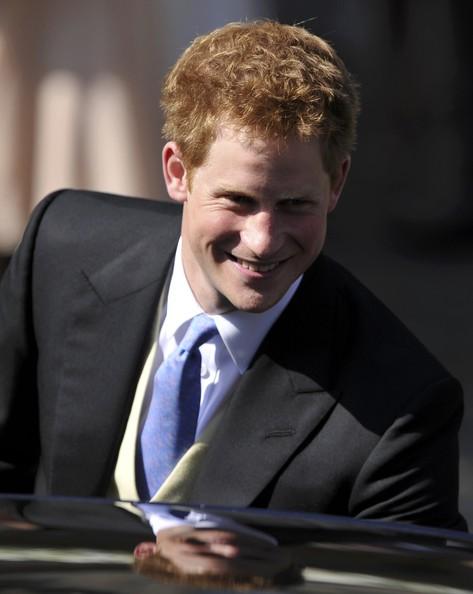 Prince Harry leaves the church after the Royal wedding of Zara Phillips and Mike Tindall at Canongate Kirk on July 30, 2011 in Edinburgh, Scotland. The Queen's granddaughter Zara Phillips will marry England rugby player Mike Tindall today at Canongate Kirk. Many royals are expected to attend including the Duke and Duchess of Cambridge.