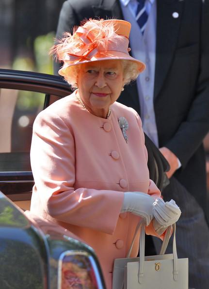 Queen Elizabeth II arrives for the Royal wedding of Zara Phillips and Mike Tindall at Canongate Kirk on July 30, 2011 in Edinburgh, Scotland. The Queen's granddaughter Zara Phillips will marry England rugby player Mike Tindall today at Canongate Kirk. Many royals are expected to attend including the Duke and Duchess of Cambridge.