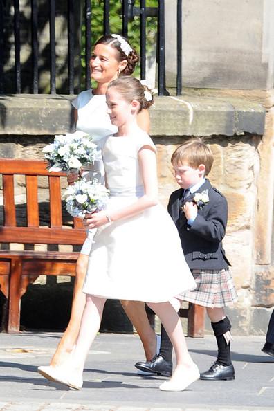 The bridesmaids arrive at Edinburgh's historic Canongate Kirk for the wedding of Zara Phillips and Mike Tindall.