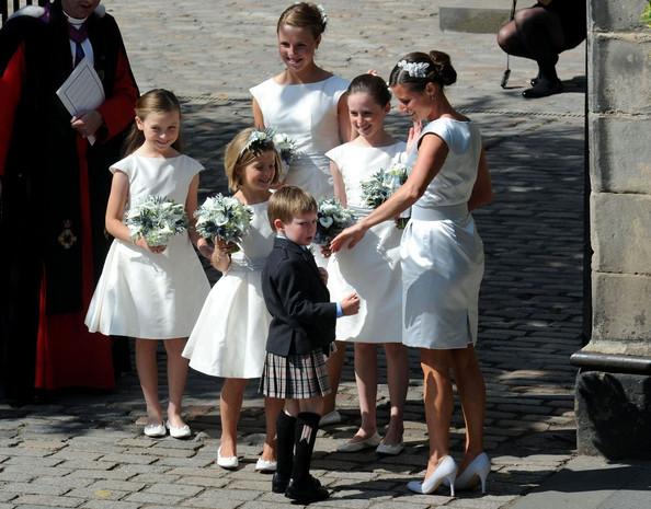 Zara Phillips and Mike Tindall are married at Canongate Kirk before members of the royal family.