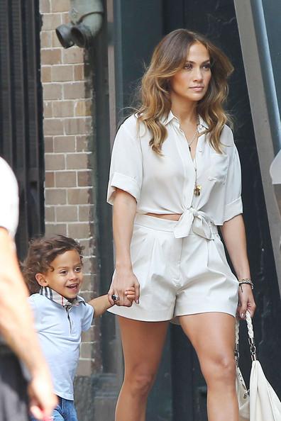 Jennifer Lopez Jennifer Lopez carries her children Max and Emme around the set of her new music video in Los Angeles. Lopez's twins were brought to the set to surprise her while filming.