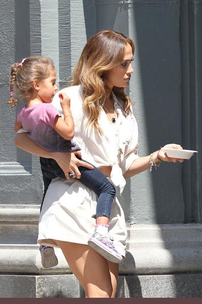 Jennifer Lopez Jennifer Lopez carries her children Max and Emme around the set of her new music video in Los Angeles. Lopez's twins were brought to the set to surprise her while filming.