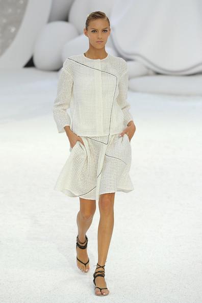 A model walks the runway during the Chanel Ready to Wear Spring / Summer 2012 show during Paris Fashion Week at Grand Palais on October 4, 2011 in Paris, France.