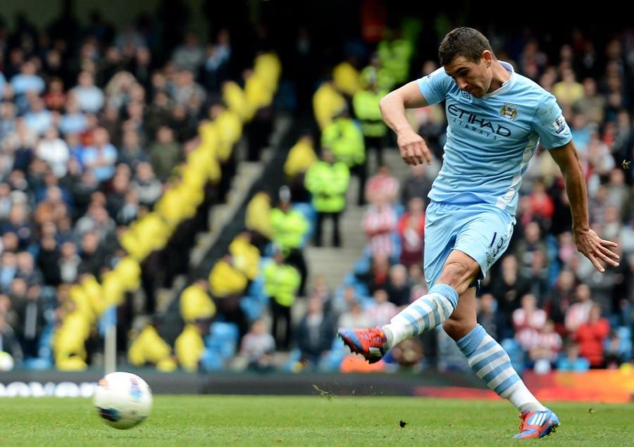 Aleksandr Kolarov shoots Manchester City level