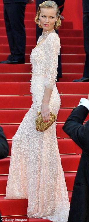 Regal elegance: Eva Herzigova wore a beautiful oyster pink gown embellished with a subtle white pattern