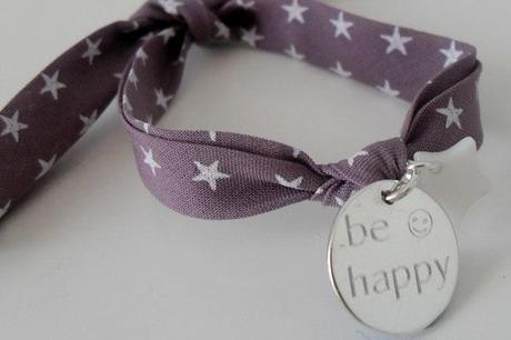 pulsera sorteo con cinta morada