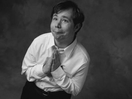 Man Praying and Smiling