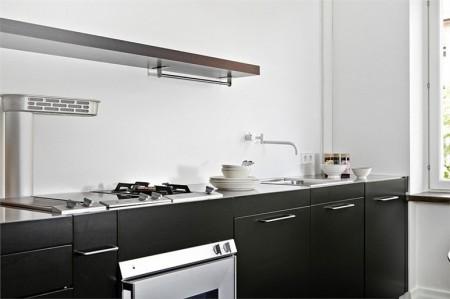 sillas eames decoración muebles de diseño decoración mecedora blanca eames decoración lámparas de diseño fotos pisos suecos estilo nórdico diseño de interiores decorar casas decoración pisos pequeños decoración escandinava decoración en blanco y negro decoración de interiores deco blog cocinas negras cocinas modernas cocinas en blanco y negro blog interiores blog decoración sueca blog decoración nórdica blog de interiorismo 